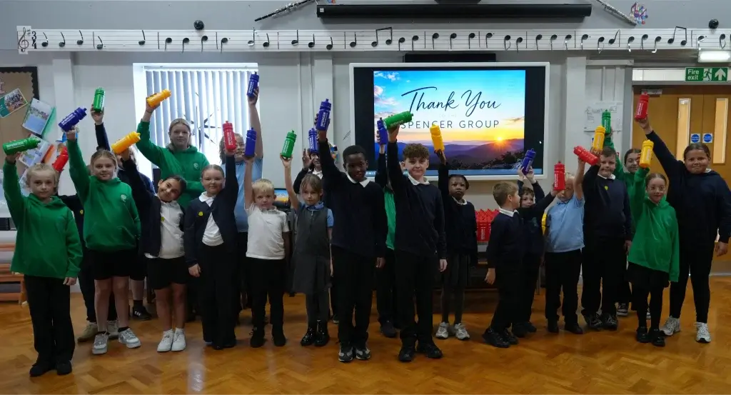 The children from Longhill Primary School holding their water bottles